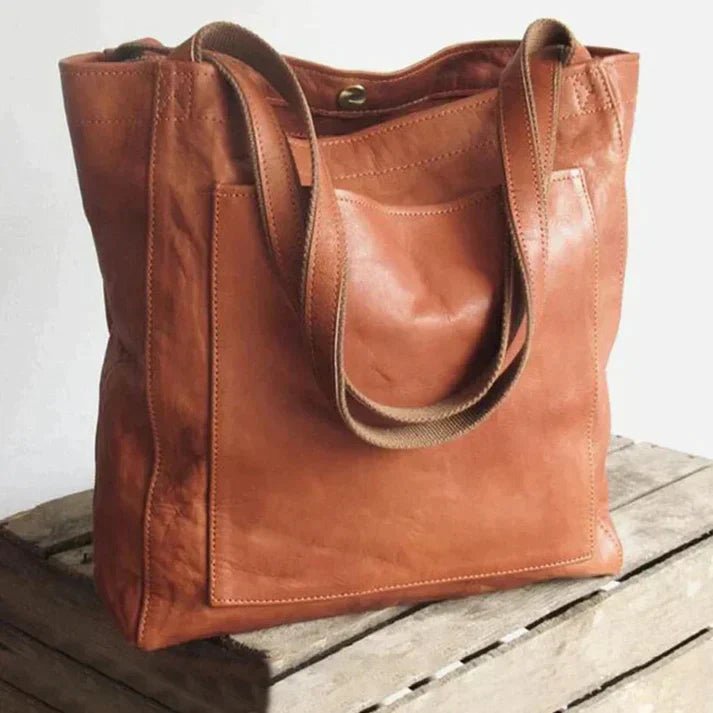 Maxi leather shoulder bag for women in classic natural leather, featuring a spacious design and a long strap, ideal for work or travel. 0